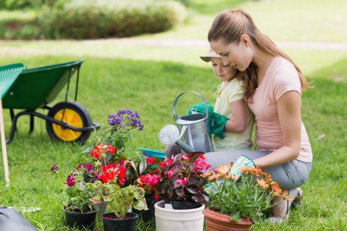 Volunteers from a local charity collecting usable garden tools